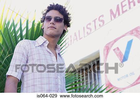 Stock Photo - Man at garage. Fotosearch