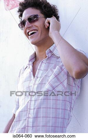 Man talking on phone View Large Photo Image Stock Image - Man talking on phone. Fotosearch