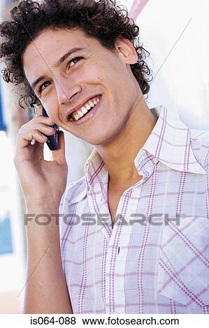 Man talking on phone View Large Photo Image Stock Photo - Man talking on phone. Fotosearch