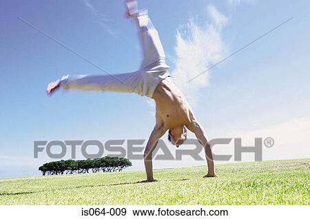Man turning wheel View Large Photo Image Stock Photo - Man turning wheel. Fotosearch