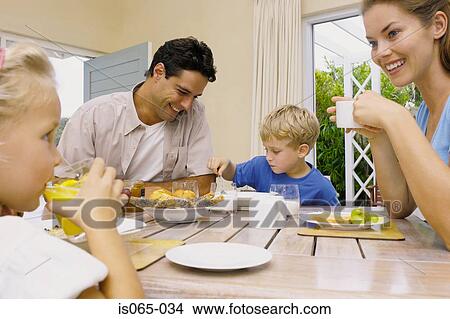 Family at breakfast View Large Photo Image Picture - Family at breakfast. Fotosearch