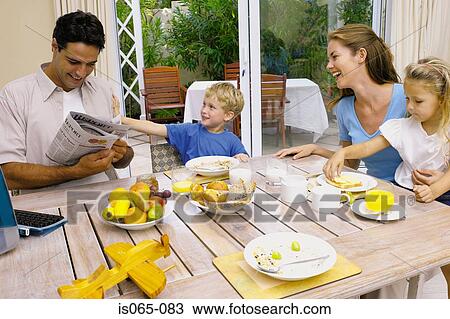 Stock Image - Family at breakfast. Fotosearch