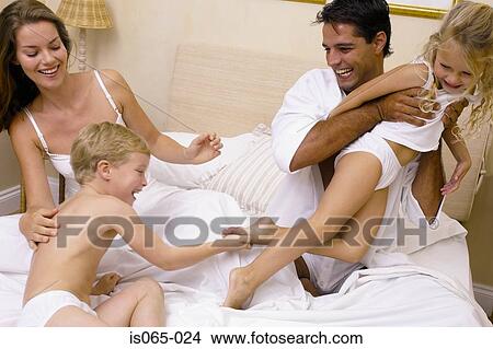Family in bed View Large Photo Image Picture - Family in bed. Fotosearch