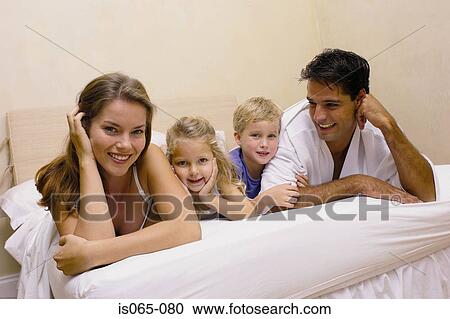 Family in bed View Large Photo Image Stock Image - Family in bed. Fotosearch