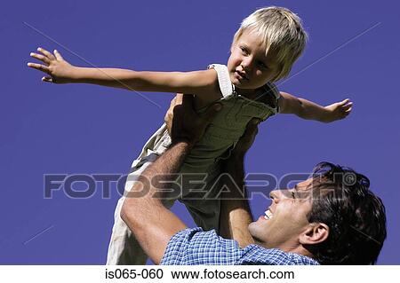 Stock Image - Father holding son. Fotosearch