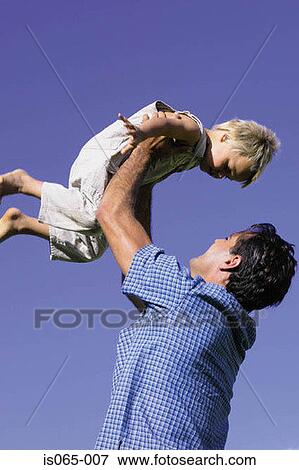 Stock Photo - Father holding son. Fotosearch
