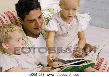 Father reading story View Large Photo Image Stock Photo - Father reading story. Fotosearch