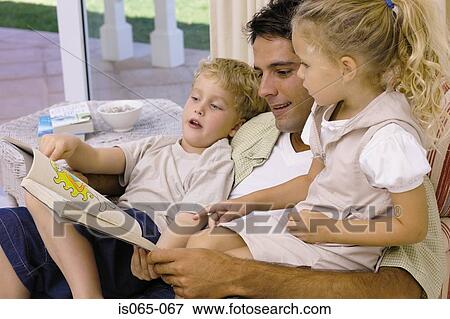 Father reading story View Large Photo Image Stock Photo - Father reading story. Fotosearch