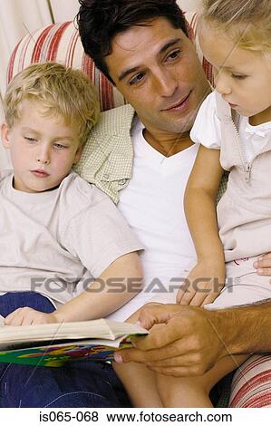 Father reading story View Large Photo Image Stock Photo - Father reading story. Fotosearch