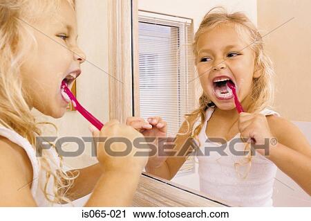 Girl brushing teeth View Large Photo Image Stock Image - Girl brushing teeth. Fotosearch