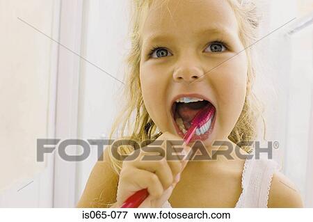 Girl brushing teeth View Large Photo Image Stock Photo - Girl brushing teeth. Fotosearch