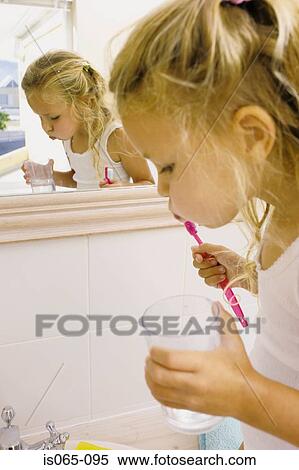 Girl brushing teeth View Large Photo Image Stock Photography - Girl brushing teeth. Fotosearch