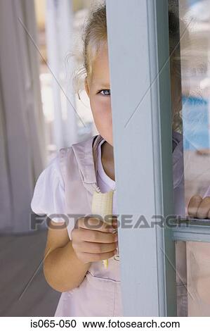 Girl eating banana View Large Photo Image Stock Image - Girl eating banana. Fotosearch