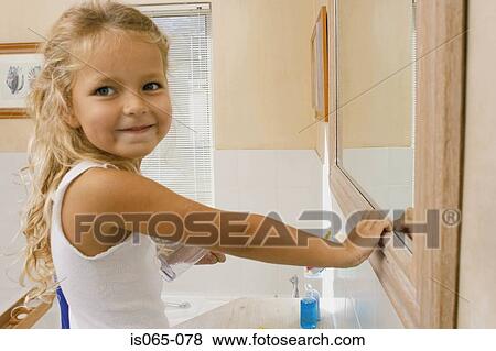 Girl in bathroom View Large Photo Image Stock Photo - Girl in bathroom. Fotosearch