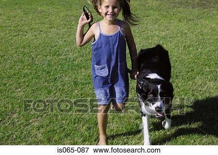 Girl walking dog View Large Photo Image Stock Photo - Girl walking dog. Fotosearch