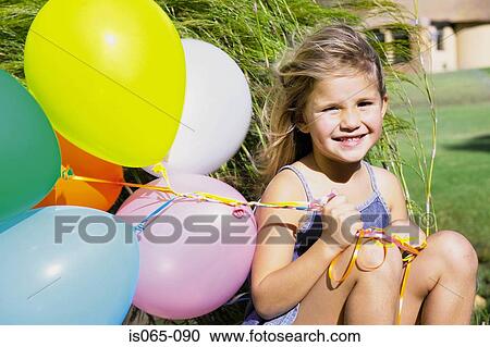 Girl with balloons View Large Photo Image Stock Image - Girl with balloons. Fotosearch