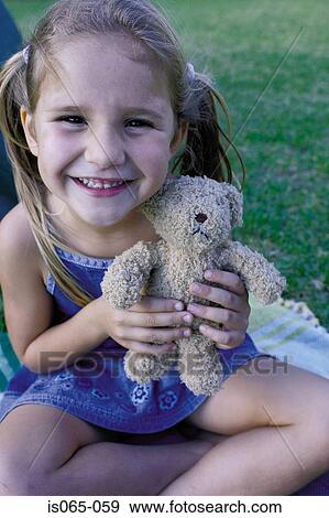 Girl with teddy View Large Photo Image Stock Photo - Girl with teddy. Fotosearch