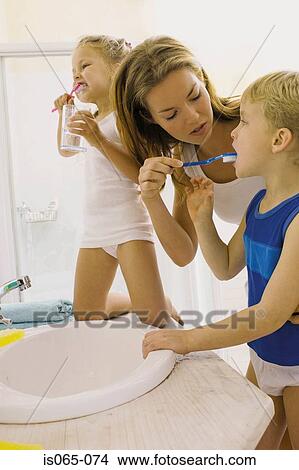 Kids brushing teeth View Large Photo Image Picture - Kids brushing teeth. Fotosearch