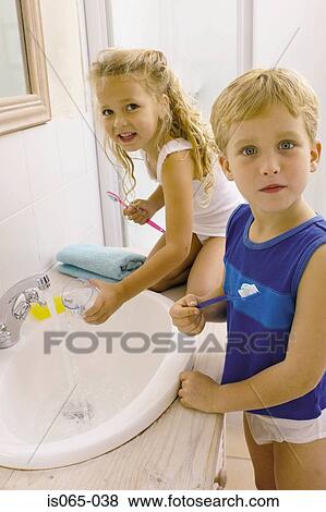 Kids brushing teeth View Large Photo Image Stock Photo - Kids brushing teeth. Fotosearch