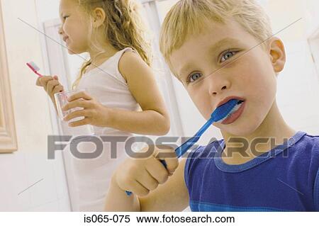Stock Photography - Kids brushing teeth. Fotosearch