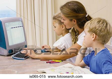 Mother and kids at computer View Large Photo Image Stock Photography - Mother and kids at computer. Fotosearch