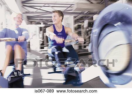 Couple rowing View Large Photo Image Stock Photo - Couple rowing. Fotosearch