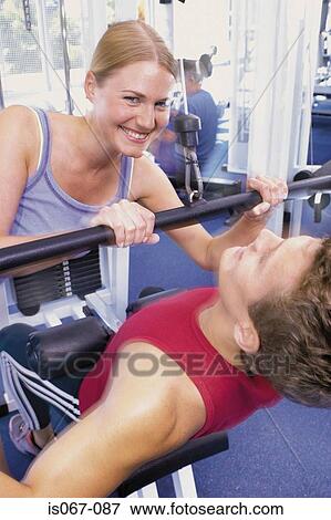 Couple weight-training View Large Photo Image Stock Photo - Couple weight-training. Fotosearch