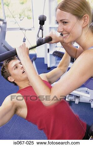 Couple weight-training View Large Photo Image Stock Photography - Couple weight-training. Fotosearch
