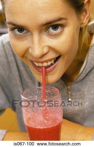 Woman drinking juice View Large Photo Image Stock Image - Woman drinking juice. Fotosearch