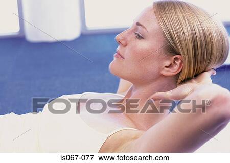 Woman working out View Large Photo Image Stock Photo - Woman working out. Fotosearch