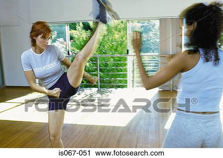 Women kick-boxing View Large Photo Image Stock Image - Women kick-boxing. Fotosearch