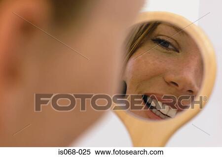 Girl looking in mirror View Large Photo Image Stock Photography - Girl looking in mirror. Fotosearch