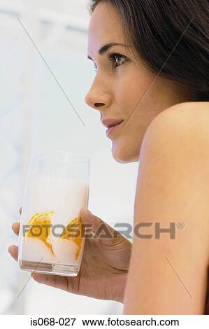 Girl with glass of milk View Large Photo Image Stock Photo - Girl with glass of milk. Fotosearch