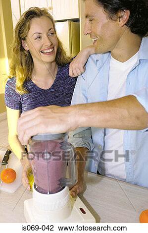 Couple in kitchen View Large Photo Image Stock Image - Couple in kitchen. Fotosearch