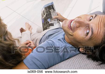 Stock Photograph - Couple on sofa. Fotosearch