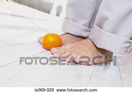 Feet and fruit View Large Photo Image Stock Photo - Feet and fruit. Fotosearch