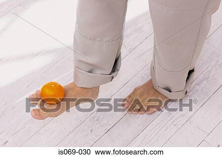 Foot balancing fruit View Large Photo Image Stock Image - Foot balancing fruit. Fotosearch
