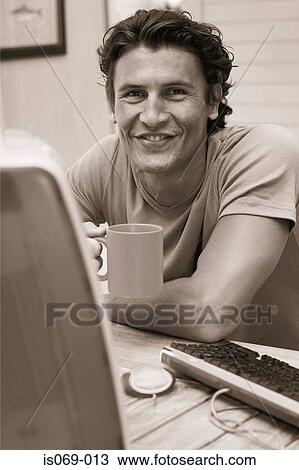 Stock Image - Man at computer. Fotosearch
