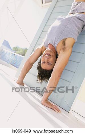 Man doing handstand View Large Photo Image Stock Photo - Man doing handstand. Fotosearch