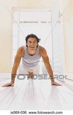 Man doing push-ups View Large Photo Image Stock Photograph - Man doing push-ups. Fotosearch