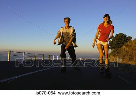 Couple roller-blading View Large Photo Image Picture - Couple roller-blading. Fotosearch