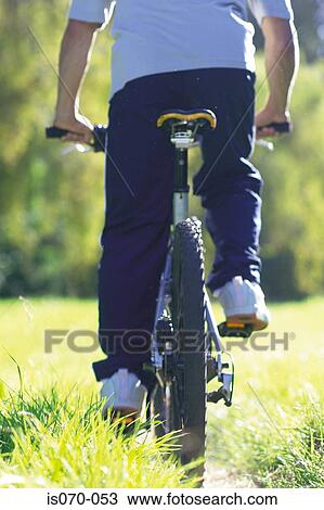 Stock Image - Man cycling. Fotosearch