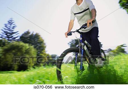 Man cycling View Large Photo Image Stock Photograph - Man cycling. Fotosearch