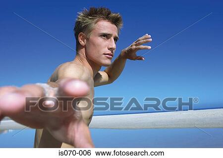 Stock Photograph - Man practising tai chi. Fotosearch