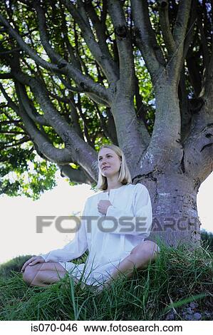Woman meditating View Large Photo Image Stock Photograph - Woman meditating. Fotosearch
