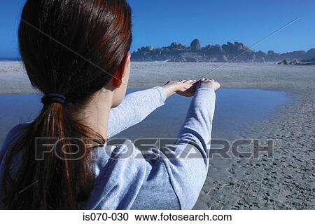Stock Image - Woman stretching. Fotosearch