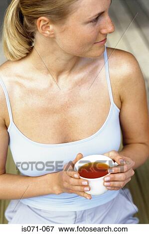 Woman drinking tea View Large Photo Image Stock Photo - Woman drinking tea. Fotosearch