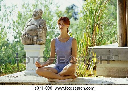 Stock Image - Woman meditating. Fotosearch