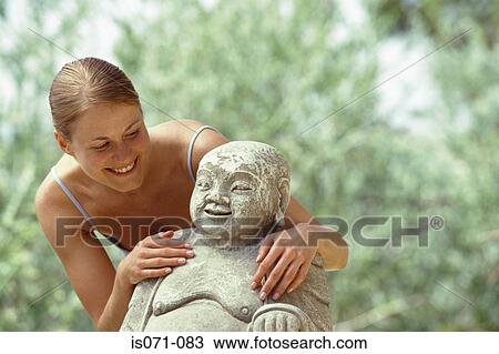 Woman with buddha View Large Photo Image Stock Image - Woman with buddha. Fotosearch