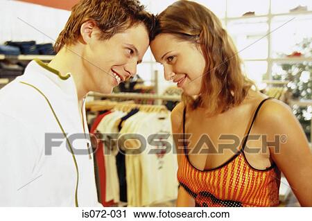 Couple in clothes shop View Large Photo Image Stock Image - Couple in clothes shop. Fotosearch